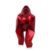 Statuetta in resina ispirata ad un gorilla dalle forme geometriche con rivestimento rosso metallizzato