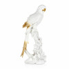 Statuetta in resina rappresentante pappagallo bianco con inserti in tinta dorata