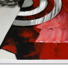 Spatolate di colore rosso e inserti metallici su tela dipinta con un soggetto astratto