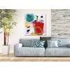 Ambiente living moderno decorato con dipinto materico astratto con macchie multicolore