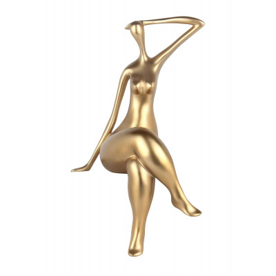 statua di donna seduta con gambe accavallate in resina effetto oro