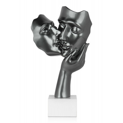 Statuetta in resina raffigurante il volto di due amanti intenti nello scambiarsi un bacio