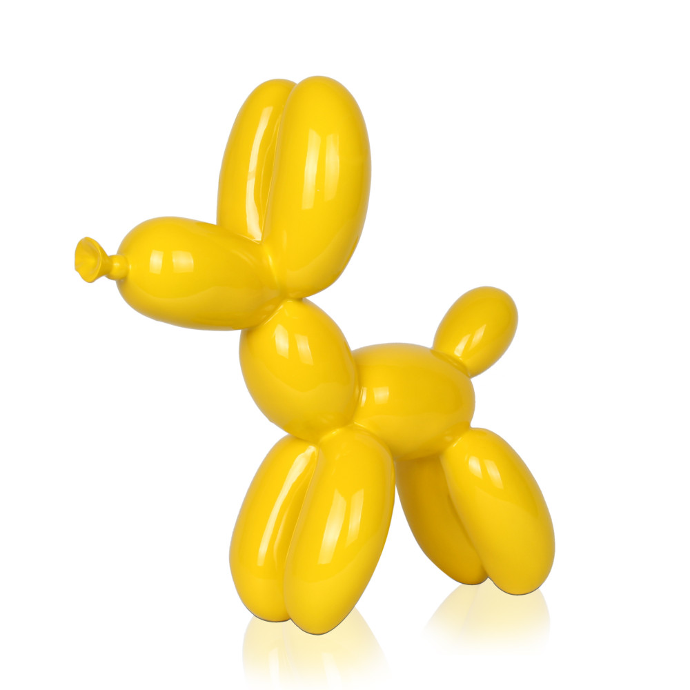 Scultura in resina raffigurante un palloncino in resina gialla laccata a forma di cane