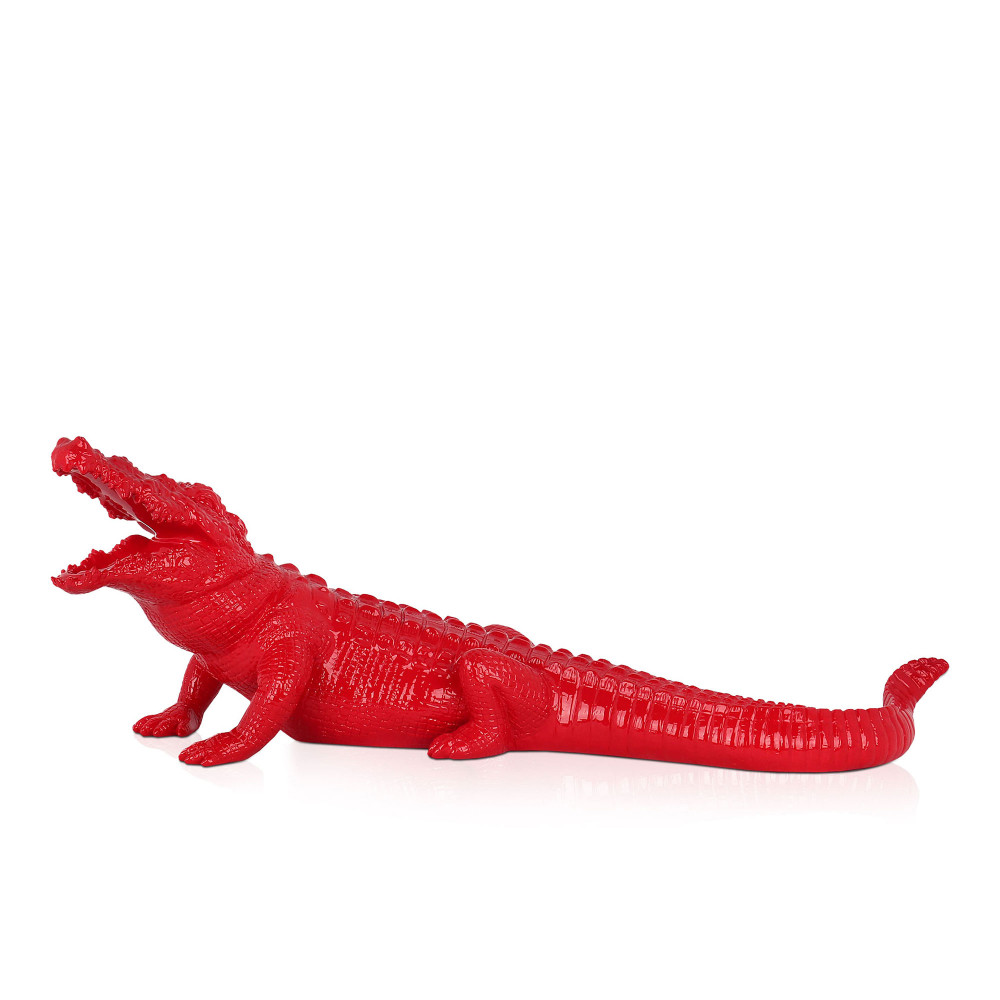 Scultura in resina di colore rosso raffigurante un coccodrillo con le fauci spalancate