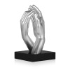 Statuetta di design con soggetto una mano maschile e una femminile che si sfiorano