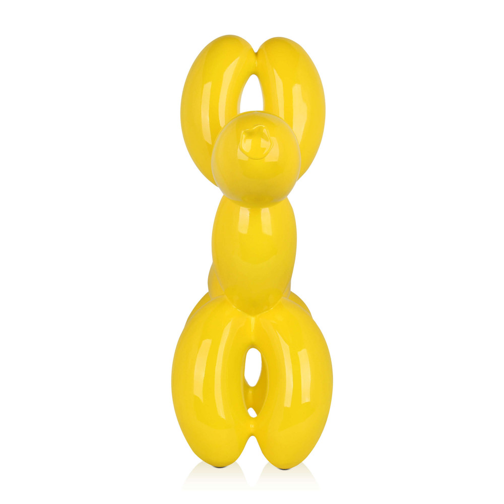 Scultura in resina ispirata ad un palloncino modellato a forma di cane con rivestimento giallo