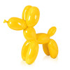 Profilo di una statuetta moderna in resinalaccata con soggetto un palloncino a forma di cane giallo